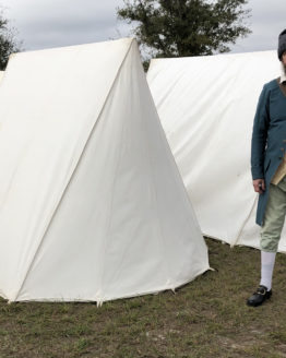 man standing next to the back of a tent