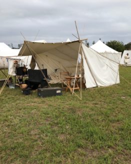 Baker style tent set up in green grass