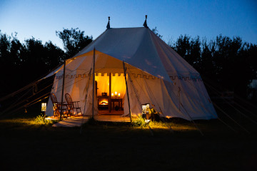 Why choose Tentsmiths? white tent with lit interior