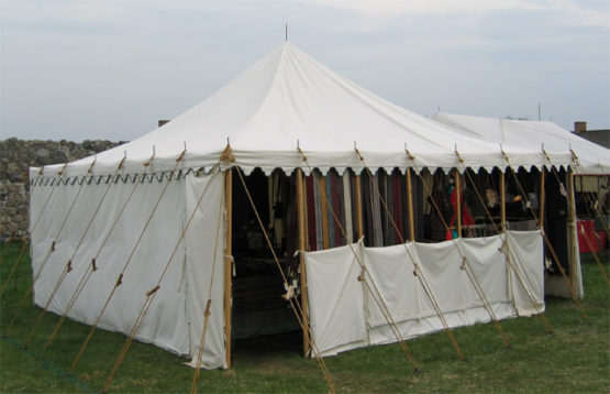 square canvas tent with a half-wall in front