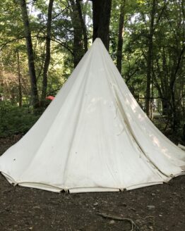 A white conical tent set up outside that is hung loosely from the support pole.