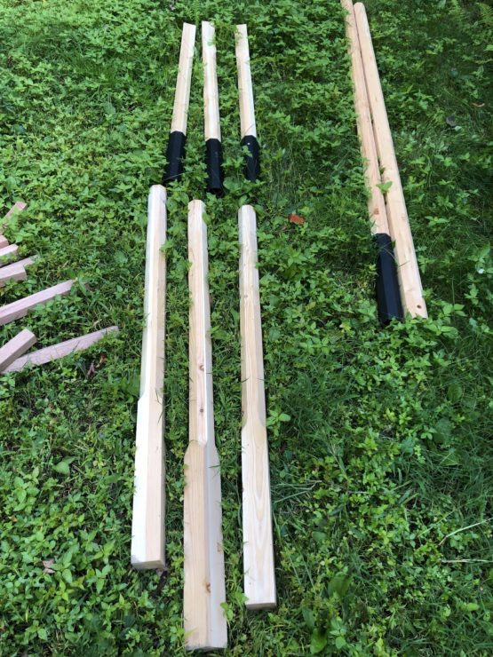 wooden poles, divided in half with a metal sleeve