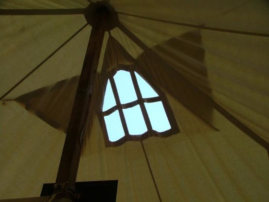 window at the top of a canvas tent roof