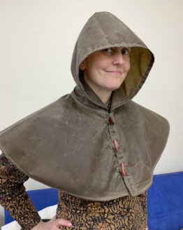 Person wearing a brown oilskin hood