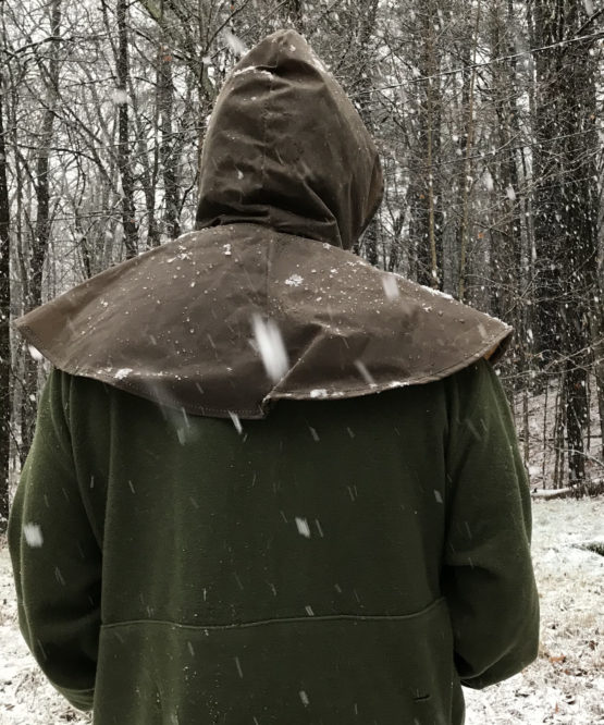 Back view of a man wearing a brown oilskin hood