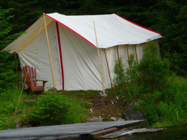 outside of a white canvas wall tent